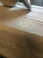 Damask tablecloth with a cream grape and grape leaf motif