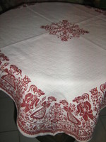 Beautiful vintage bavarian motif burst on white background Tyrolean girl-boy and floral kind woven tablecloth