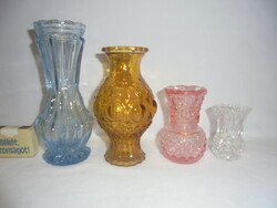 Four old glass vases together - amber, blue, pink, white