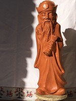 The wise, large-scale terracotta statue.