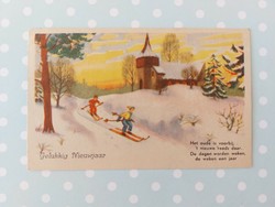 Old Christmas card postcard with children skiing