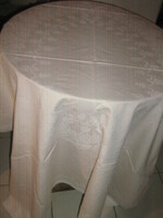 Beautiful elegant floral pattern on pale beige damask tablecloth tablecloth