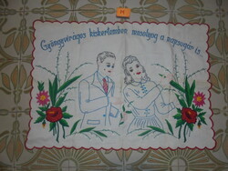 Old hand-embroidered scene wall protector with the inscription 