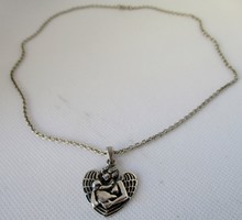 A very special old silver guardian angel pendant on a silver necklace