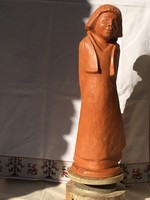 The girl, a large terracotta statue