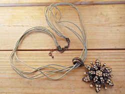 Stony flower pendant on fabric chain