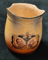 Some sort of spout (milk? Coffee?) I.Vh. With two dominant images