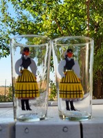 A pair of soft drinks and water glasses in the folk costume of Transylvania, Harghita