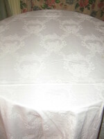 Beautiful white vintage baroque floral pattern on huge damask tablecloth