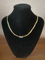 Gold necklace with brilliant stone