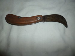 Old kacor knife with a large wooden handle