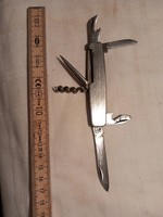 Multi-functional knife with metal housing, marked