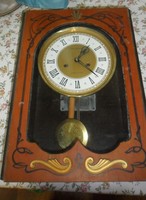 Old Russian amber wall clock with winding key.