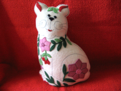 Handmade cat figurine with flower appliqué
