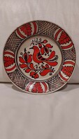 Folk ceramic painted wall bowl, bright red bird