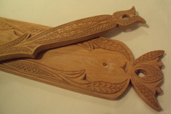 Carefully carved mangrove wall decoration with a wooden spoon. Folk art work, made of fine wood.