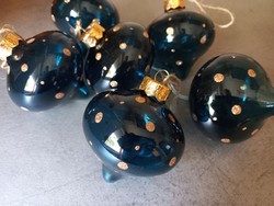 Transparent blue glass Christmas tree ornament in the shape of an onion with gold dots