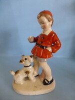 Little girl playing with an antique German dog