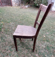 Antique art deco chair with a beautiful curved back, damaged, to be renovated