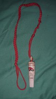 Old 1970s pioneer whistle with cord as pictured