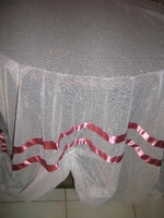 Beautiful vintage crocheted rococo style curtain decorated with dark pink ribbon with lace edge