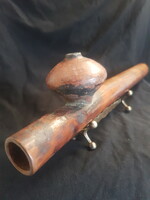 An opium pipe is an old piece, perhaps more than 100 years old