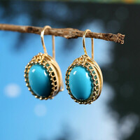 Large turquoise stone earrings in a gold-colored socket 388