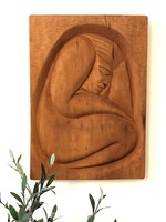 Noble in its simplicity, it is a completely unique relief made of wood