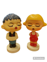 Retro plastic little girl and boy with a nodding head