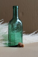 Régi zöld domború feliratos gyógyszeres üveg
