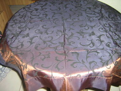 Beautiful baroque leaf pattern on elegant shiny brown silk tablecloth