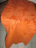 Beautiful runner in vintage red rose on orange velvet tablecloth