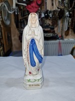 Old Virgin Mary figure.
