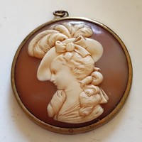 Old English plastic cameo pendant in metal frame marked