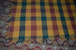 A checkered tablecloth with a large woven pattern - bedspread