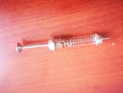 Glass-metal syringe