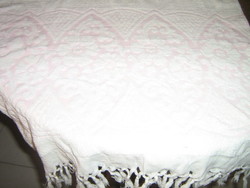 White and pink fringed towel with a printed pattern in its beautiful fabric