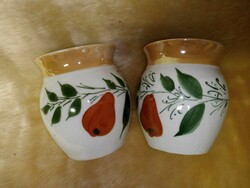 Pear-patterned sour cream mugs with bellies are sold in pairs, collectible pieces for a display case.