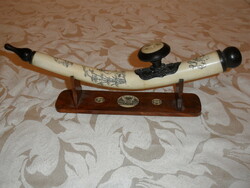 Far Eastern hand-painted, bone opium pipe on a wooden stand