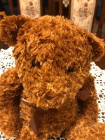 Handmade plush bear. Very soft, very beautiful. With a shiny bow around the neck. 50 Cm