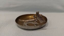 Figure of a dog walking on the rim of an Art Deco bowl