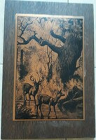 Nature-themed etching on wood