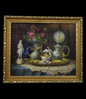 Framed antique oil still life in an ornate frame