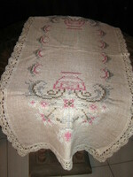 Beautiful floral pattern on vintage embroidered cross stitch woven tablecloth running