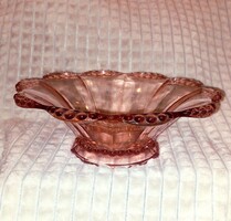 Pink glass offering, center of the table.