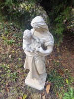 Plaster statue of a saint, damaged.