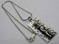 Special old handmade Mayan silver pendant on a silver necklace