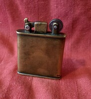 Interesting old petrol lighter