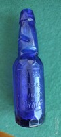 Blue soda bottle with ball cap