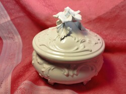 Snow-white porcelain bonbonier, jewelry holder with a hand-shaped rose